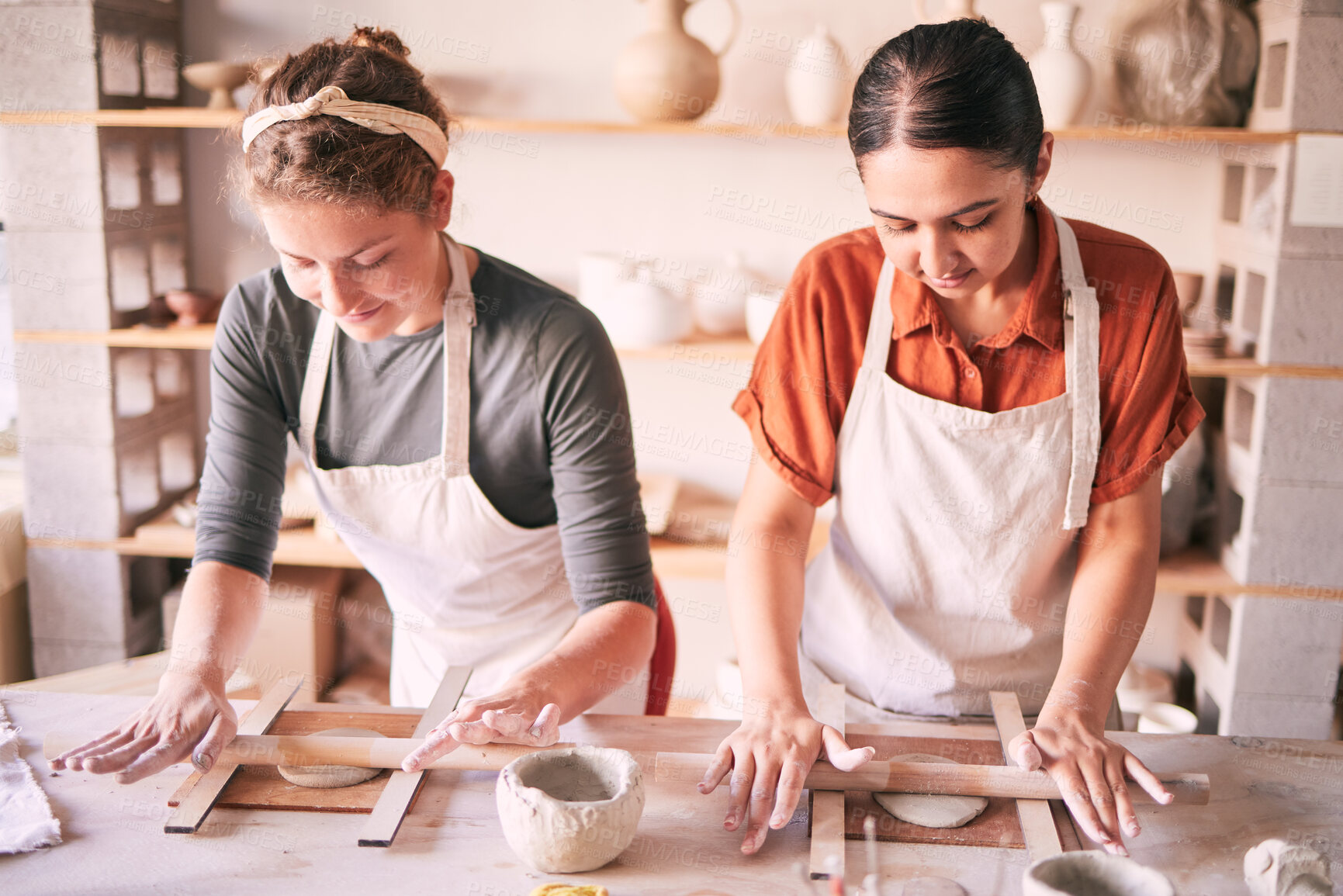 Buy stock photo Pottery, design and small business people in workshop teamwork, collaboration and startup production. Clay, manufacturing and creative woman, artist or partner working together on sculpture process