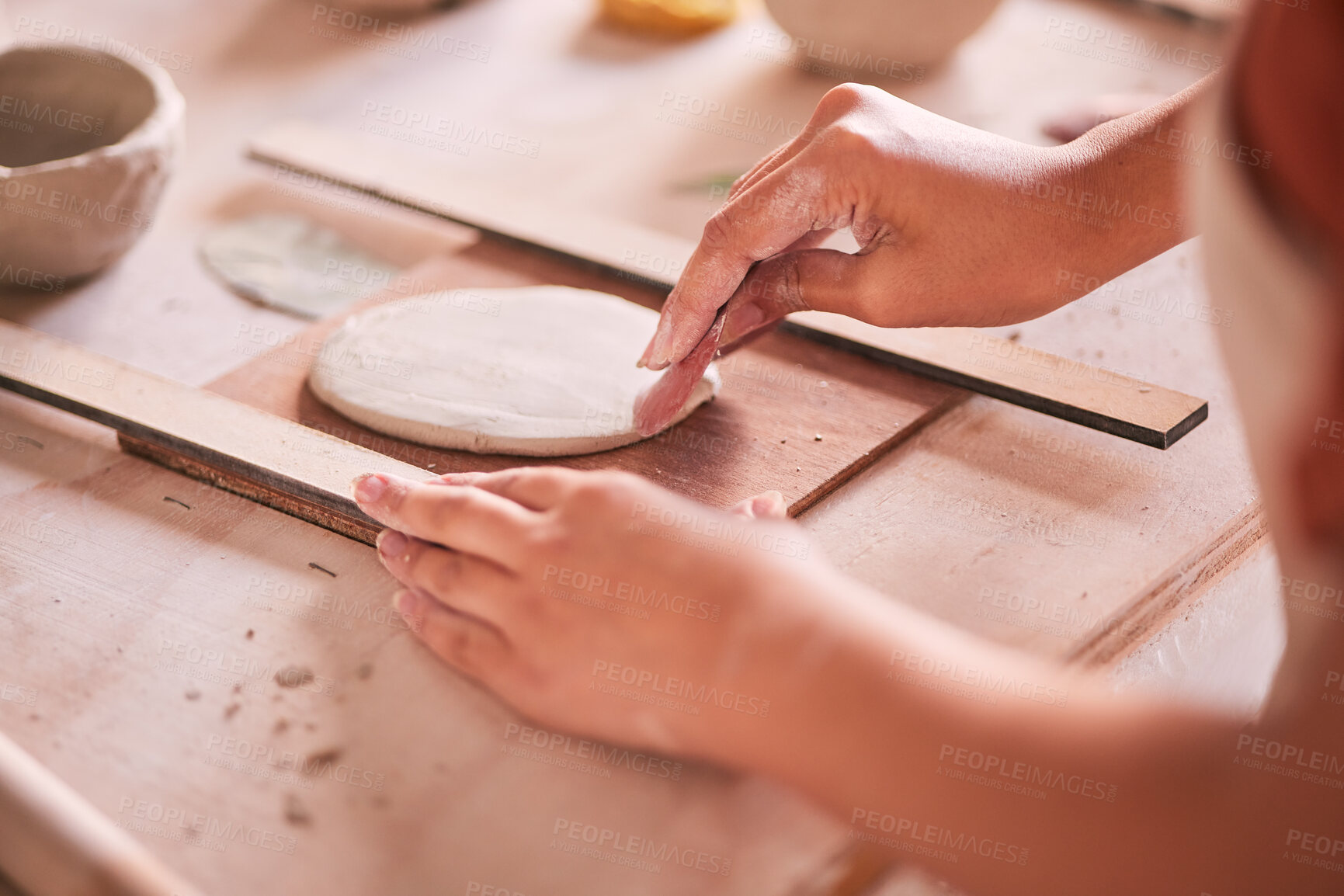 Buy stock photo Ceramics, pottery and design with hands of woman in workshop studio for mold, creative and art. Clay, sculpture and manufacturing with girl artisan on table for crafting, handmade and hobby
