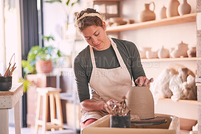 Buy stock photo Pottery wheel, mold and woman design sculpture, clay manufacturing process or art product. Creative retail store, craft process and startup small business owner, employee or artist in studio workshop