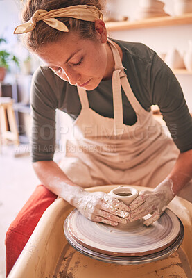 Buy stock photo Woman, sculpture artist and mud wheel for clay design, creative manufacturing and expert focus in studio workshop. Female, pottery process and small business designer working with ceramic craft 