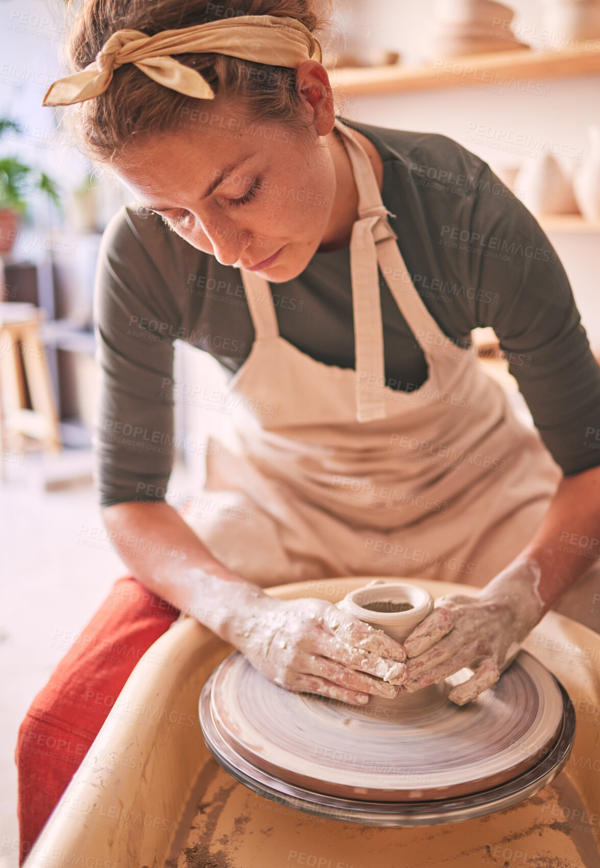 Buy stock photo Woman, sculpture artist and mud wheel for clay design, creative manufacturing and expert focus in studio workshop. Female, pottery process and small business designer working with ceramic craft 
