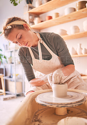 Buy stock photo Woman, clay artist and pottery wheel for sculpture design, creative manufacturing and expert focus in studio workshop. Female, mud process and small business designer working with ceramic craft 