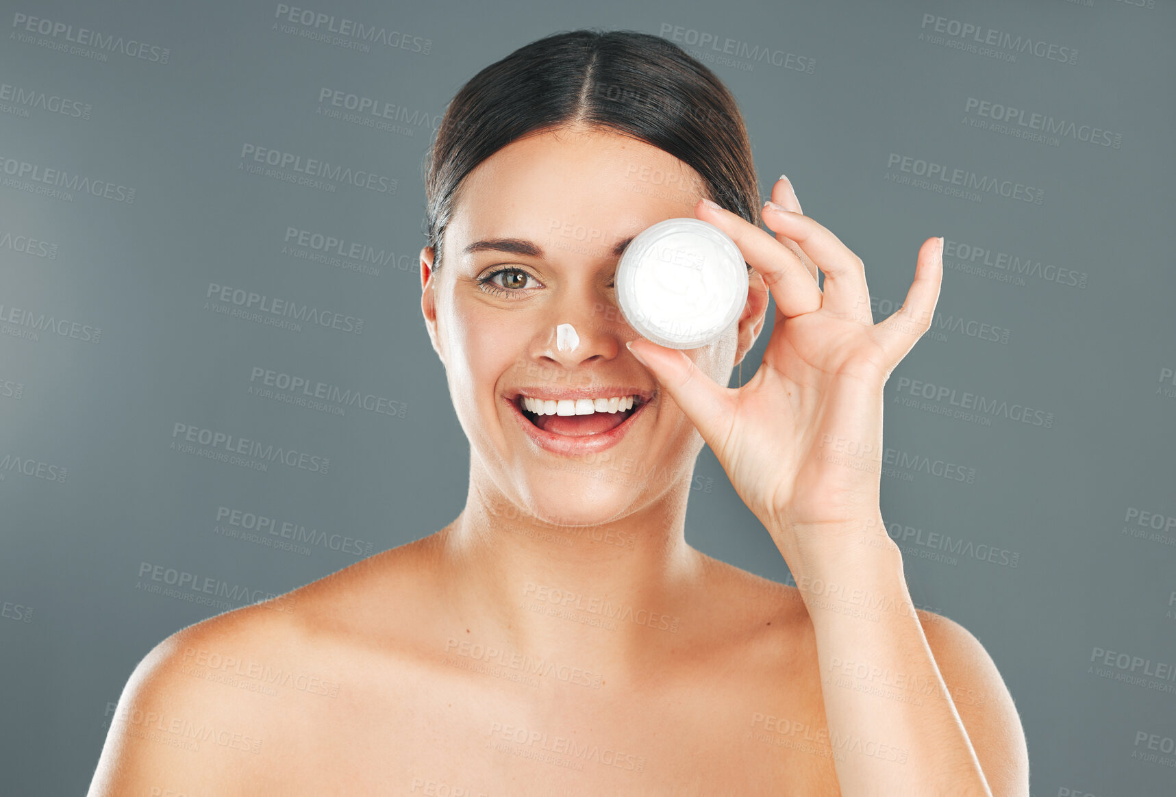Buy stock photo Woman apply cream for face with happiness and beauty portrait, skincare and moisturizer isolated on studio background. Sunscreen, lotion and healthy skin glow, wellness and facial treatment product
