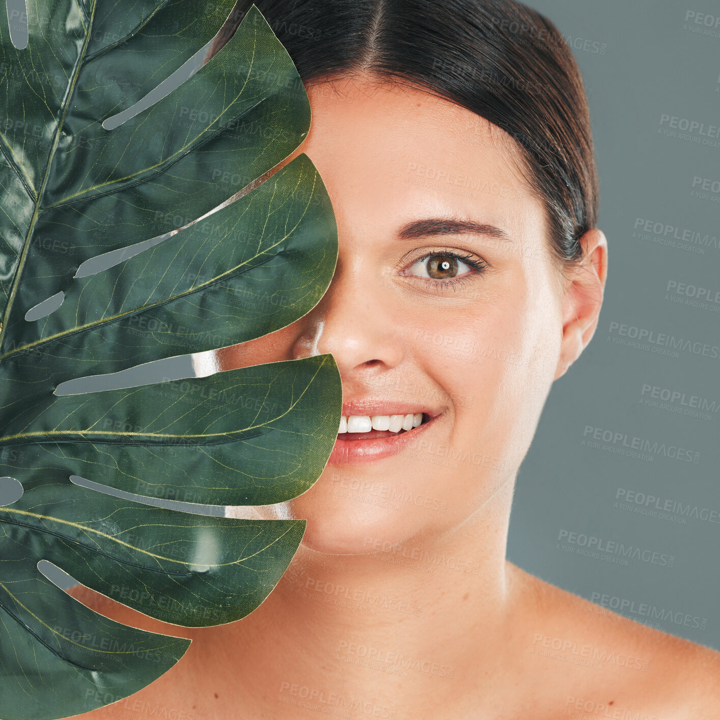 Buy stock photo Palm leaf, face and woman in portrait with smile, beauty and skincare with natural cosmetics isolated in studio background. Healthy skin, wellness and glow, facial and eco friendly cosmetic treatment
