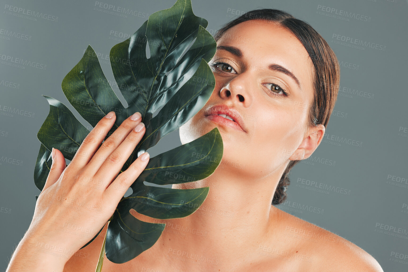 Buy stock photo Leaf, face and woman in portrait, beauty and hand with manicure and natural cosmetics isolated on studio background. Eco friendly cosmetic care, facial and skincare with dermatology and wellness