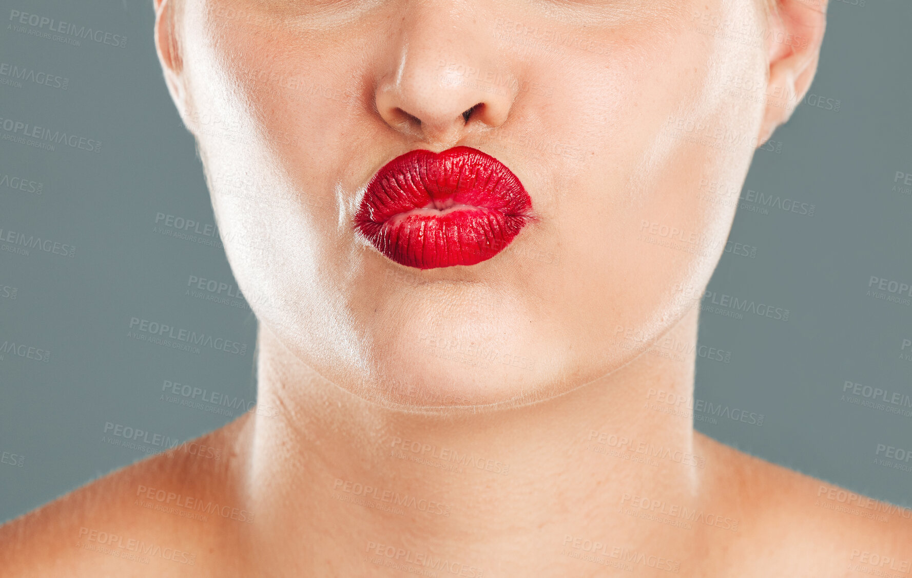 Buy stock photo Kiss face zoom, lipstick and woman lips with makeup, red cosmetics and pout isolated on studio background. Healthy skin, beauty and skincare with cosmetic care, wellness and facial glow with shine