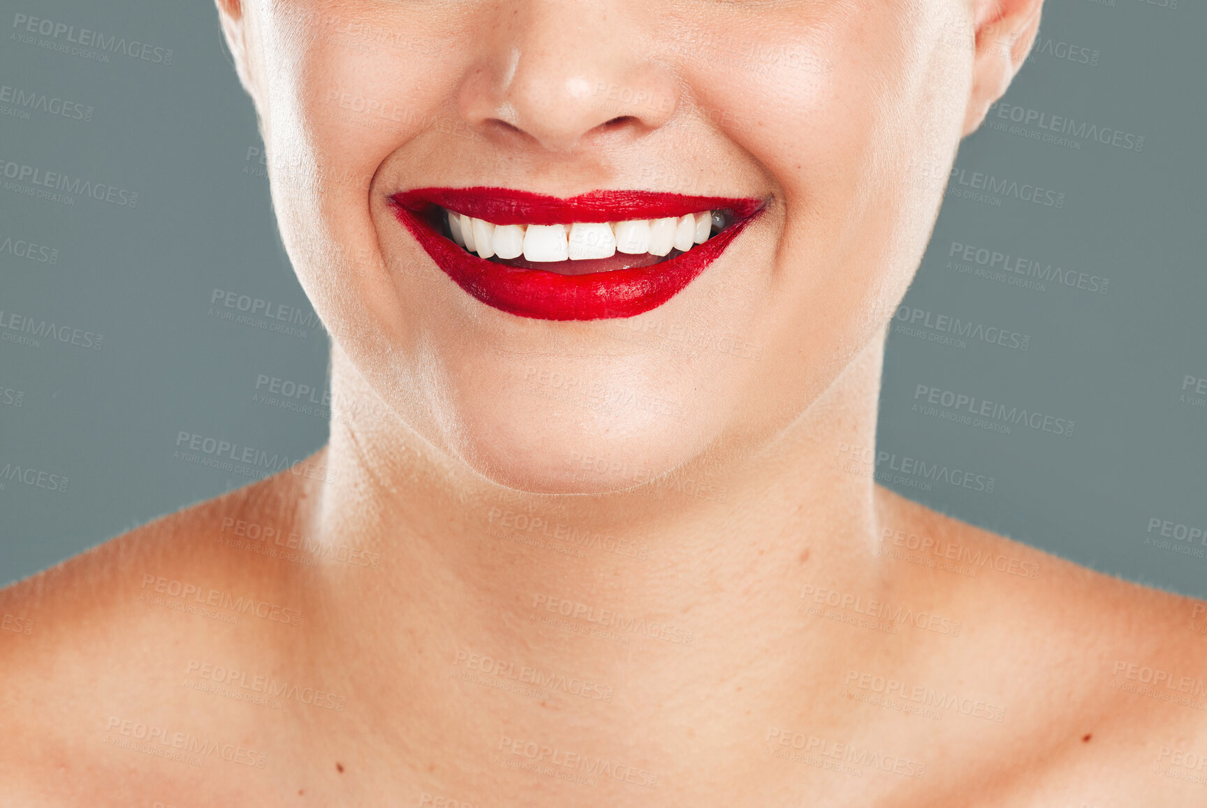 Buy stock photo Woman, red lipstick and smile for makeup cosmetics, skincare or beauty against a grey studio background. Happy female model smiling with cosmetic lips or mouth for beautiful color aesthetic treatment