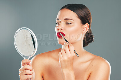 Buy stock photo Lipstick, mirror and woman face getting ready with cosmetics and makeup brush. Mouth, female and beauty model looking at reflection with cosmetic tool with isolated studio background and lips product