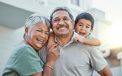 Buy stock photo Grandparents, hug and child with smile for happy holiday or weekend break with elderly people at the house. Portrait of grandma and grandpa holding little boy on back for fun playful summer together