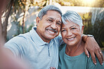 Love, selfie and portrait of a senior couple sitting outdoor in the backyard of a house. Happy, smile and elderly man and woman pensioners in retirement taking picture while relaxing in a home garden