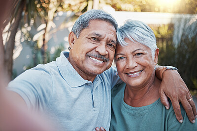 Buy stock photo Love, selfie and portrait of a senior couple sitting outdoor in the backyard of a house. Happy, smile and elderly man and woman pensioners in retirement taking picture while relaxing in a home garden