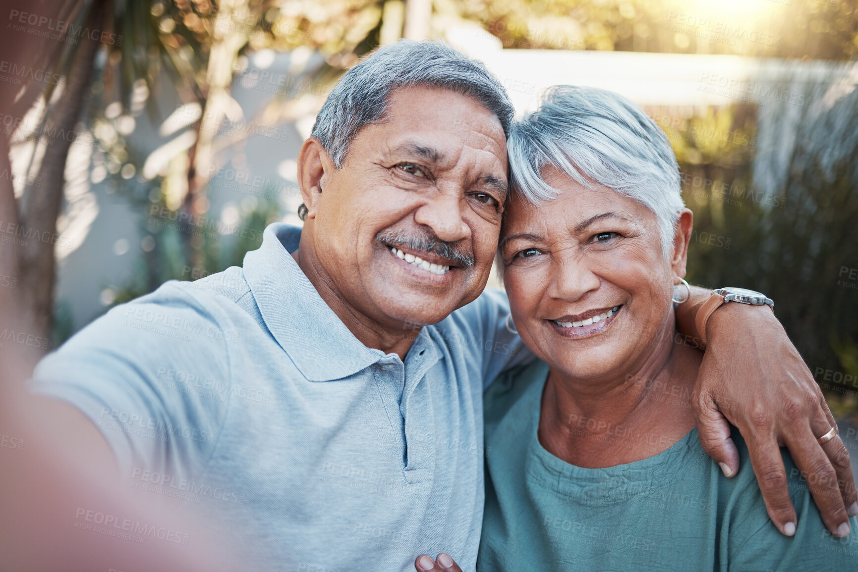 Buy stock photo Love, selfie and portrait of a senior couple sitting outdoor in the backyard of a house. Happy, smile and elderly man and woman pensioners in retirement taking picture while relaxing in a home garden