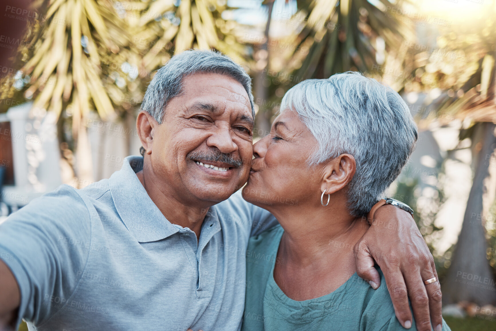 Buy stock photo Senior couple, selfie and kiss outdoor portrait with love, happiness and care with a smile in garden. Happy retirement, profile picture and hug of elderly people enjoying life and marriage  