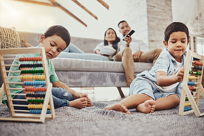 Buy stock photo Math, family or children learning for development growth with mother and father relaxing watching tv. Education, siblings or young boys playing fun toys or counting games for kids at home together