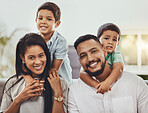 Mother, father and children hugging parents with smile relaxing together for holiday or weekend at home. Portrait of happy mom, dad and kids smiling for hug, love or care in relax for family time