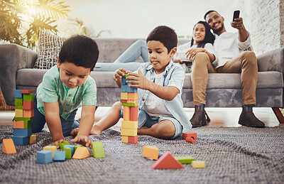Buy stock photo Building blocks, family or children learning for development growth with mother and father relaxing watching tv. Education, siblings or young boys playing fun toys or games for kids at home together