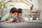 Tablet, children on carpet and family relax on sofa for home internet, elearning development app or online games. Kids on ground or floor and digital technology for youth website and parents on couch