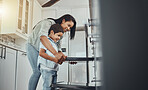 Baking, fun and child helping mother with food, cooking and learning by the oven in the kitchen. Breakfast, happy and mom and boy kid making lunch, dinner or a snack together in their family home