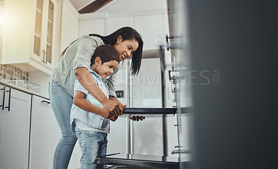 Buy stock photo Baking, fun and child helping mother with food, cooking and learning by the oven in the kitchen. Breakfast, happy and mom and boy kid making lunch, dinner or a snack together in their family home