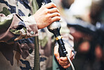 Closeup paintball gun, hands and man with camouflage clothes, ready and start for outdoor combat game. Weapon, war games and adventure for training, shooting and workout for tactical development