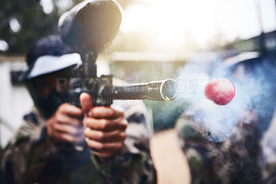 Buy stock photo Paintball, gun and ball closeup with person shooting for fun, extreme and sport, fitness and training. Zoom, paintball marker, and target, practice and game with people competing, speed and power