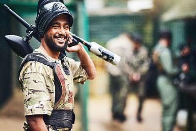 Buy stock photo Smile, portrait or man and paintball gun in games arena, teamwork leadership or sports challenge in military uniform. Happy, shooter or playing rifle for soldier, army person or fun warfare training
