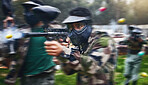 Paintball gun, shooting and men in camouflage with safety gear at military game for target practise. Teamwork, sports training and war games, play with rifle and friends working together at army park