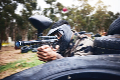 Buy stock photo Paintball, gun or man playing a shooting game with fast action on a fun battlefield on holiday. Military mission, fitness or player aiming with weapons gear for war survival in an outdoor competition