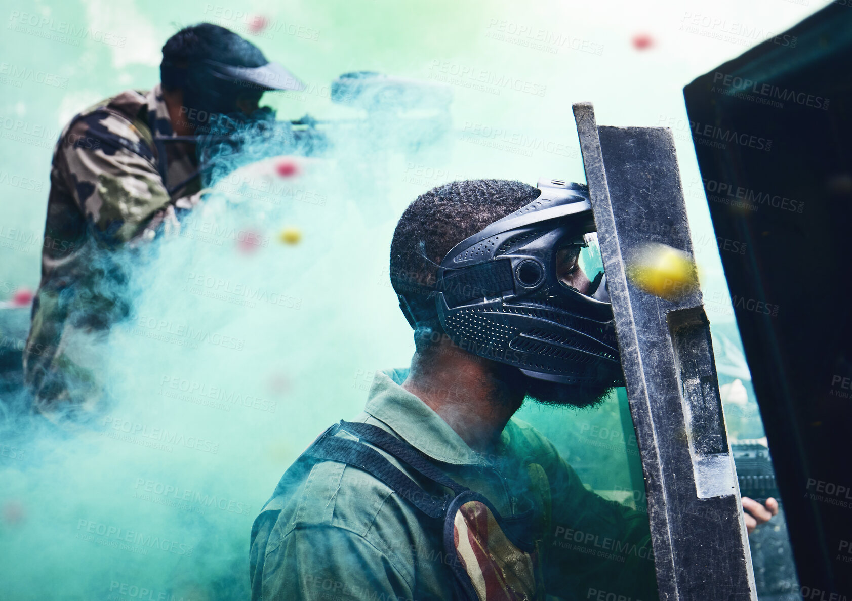 Buy stock photo Paintball team, shooting together and war game with shield, mask or tactical strategy for safety, competition or contest. Outdoor teamwork, team building and vision with weapon, combat and friends