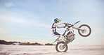 Motorbike, motorcycle athlete and desert drive with mockup cycling in nature for sport adventure. Jump, freedom and sports driving training of a man with speed on sand trail for fitness and exercise