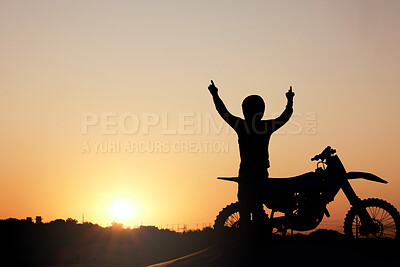 Buy stock photo Motorcycle, silhouette and sunset with a sports man outdoor, arms raised in celebration for freedom with mockup. Sky, nature and motorbike with a male rider outside celebrating on a road trip