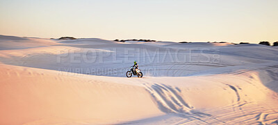 Buy stock photo Desert, motorbike and extreme sports of a man on sand dunes in Africa doing sport fitness. Driving challenge, beach adventure and cycling travel of a athlete in nature training for moto cross 