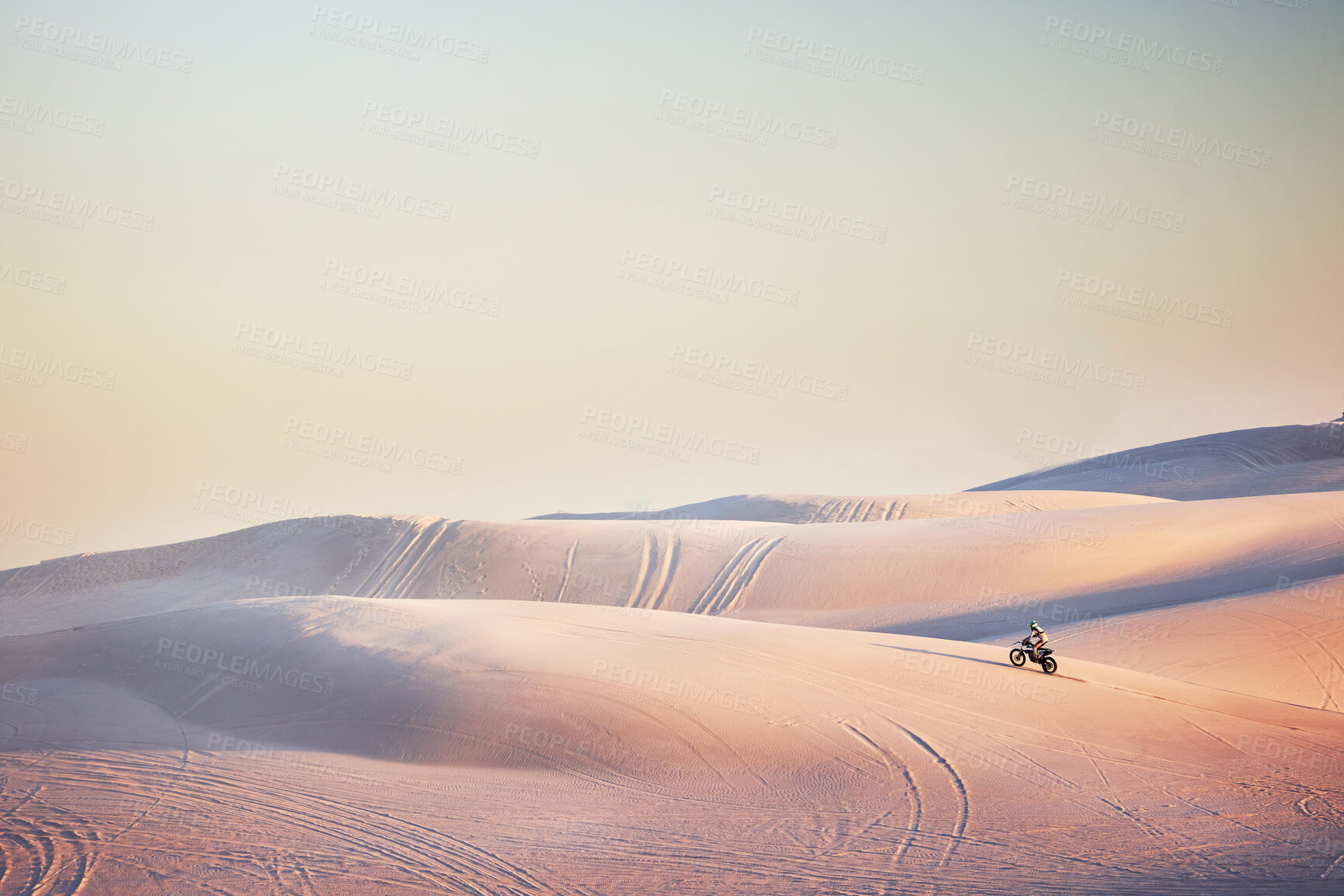 Buy stock photo Sand landscape, motorbike or man on moto cross in desert space for sport workout, sunset ride or exercise on hill. Nature, sky or man riding for speed adventure in Dubai for training, fitness or race