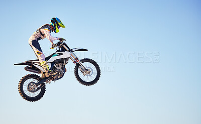 Buy stock photo Motorcycle, jump and person on blue sky mockup for training, competition or challenge with safety gear. Professional cycling, motorbike and adventure with speed, sports and danger in mock up space
