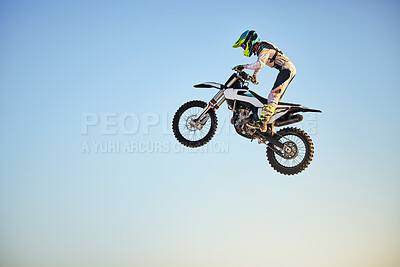 Buy stock photo Motorbike, jump and person on blue sky mockup for training, competition and challenge with safety gear. Professional cycling, motorbike and adventure with speed, sports and danger on mock up space
