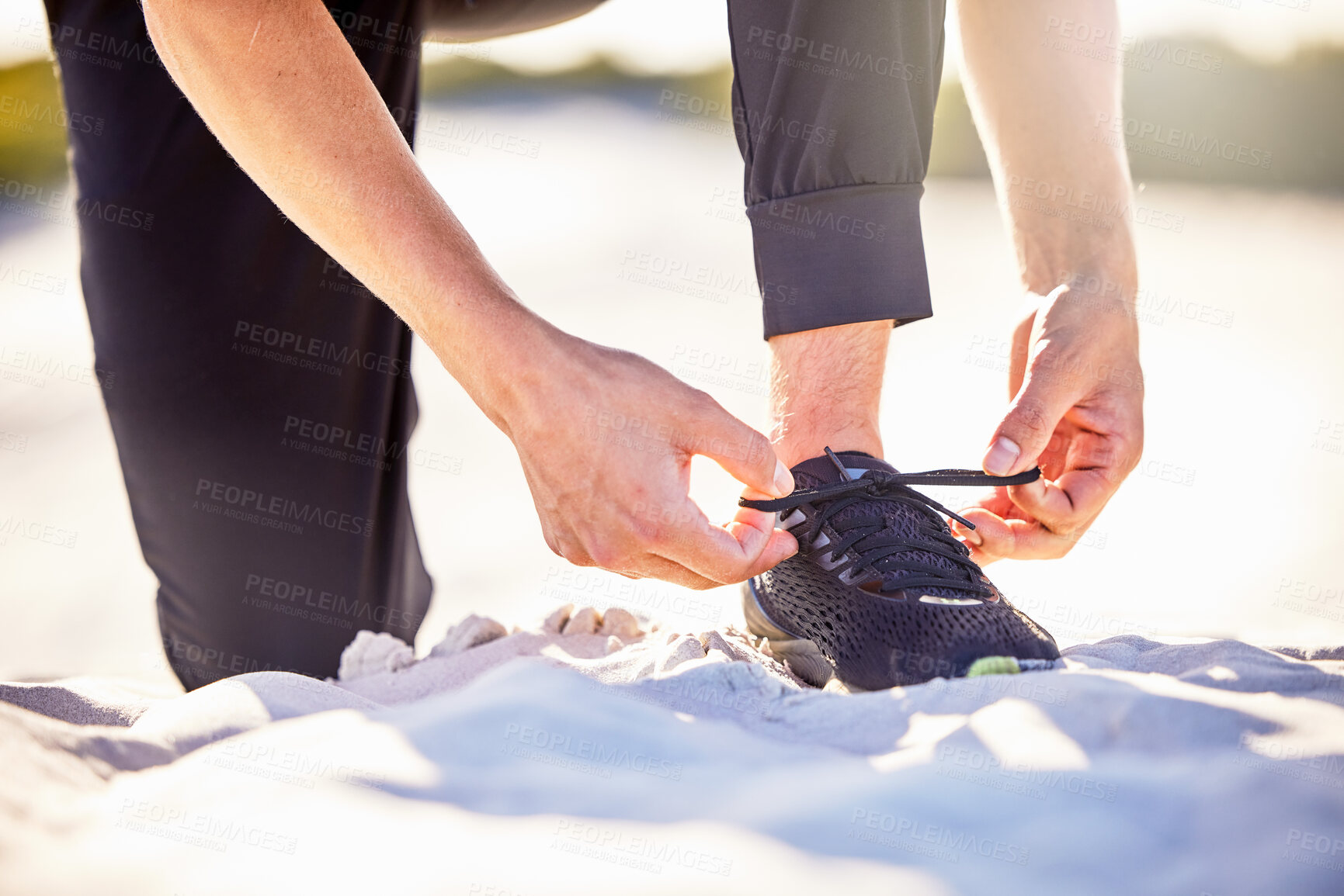 Buy stock photo Hands, shoes and tying lace on sand for running exercise, travel or workout outdoors. Hand of sporty person tie shoe for run, exercising or training in preparation or getting ready for active cardio