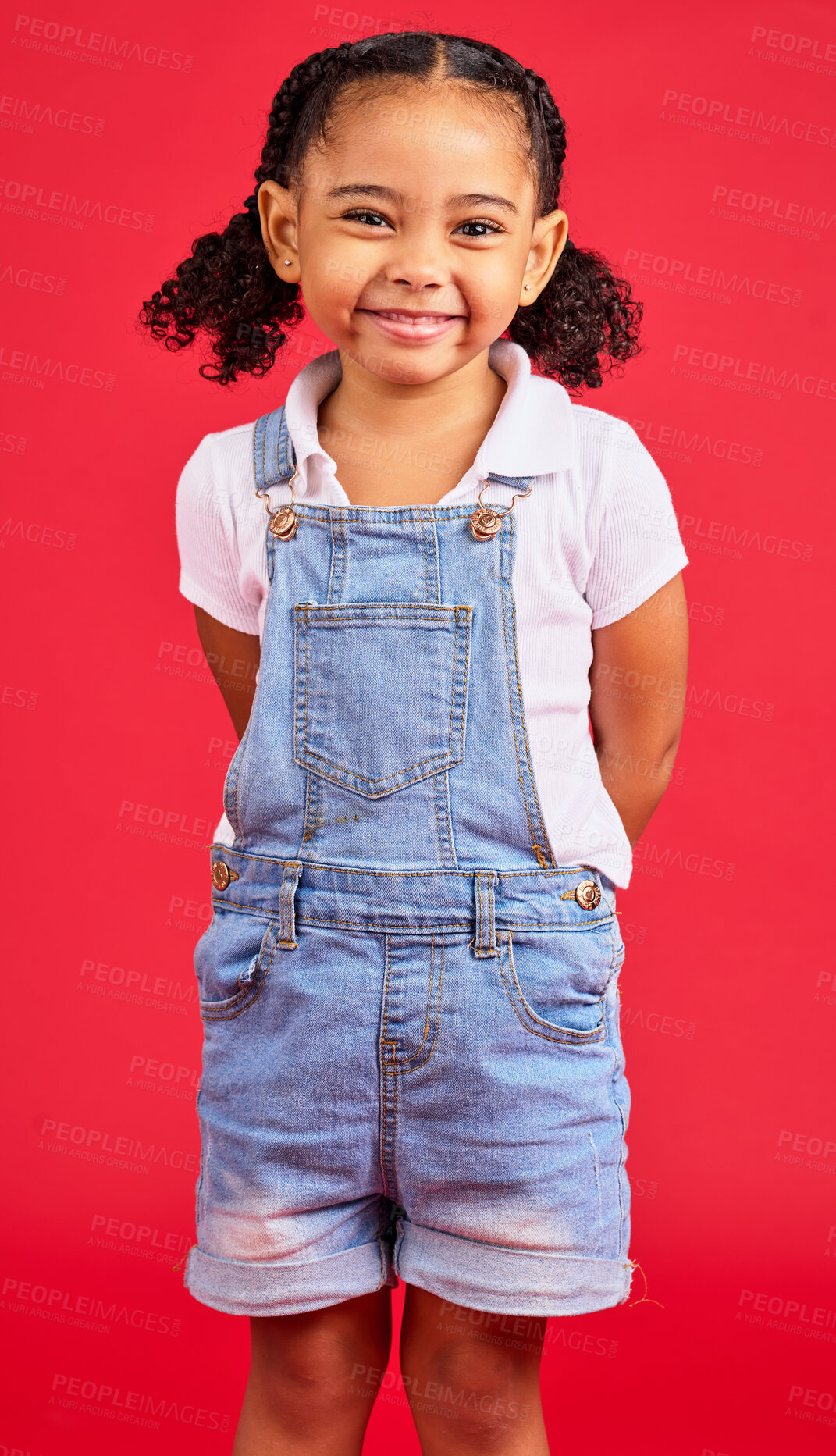 Buy stock photo Child, little and portrait of girl in studio, happy and smile on red background with mockup. Face, cheerful and trendy toddler standing against space, excited and positive, smiling and pose isolated