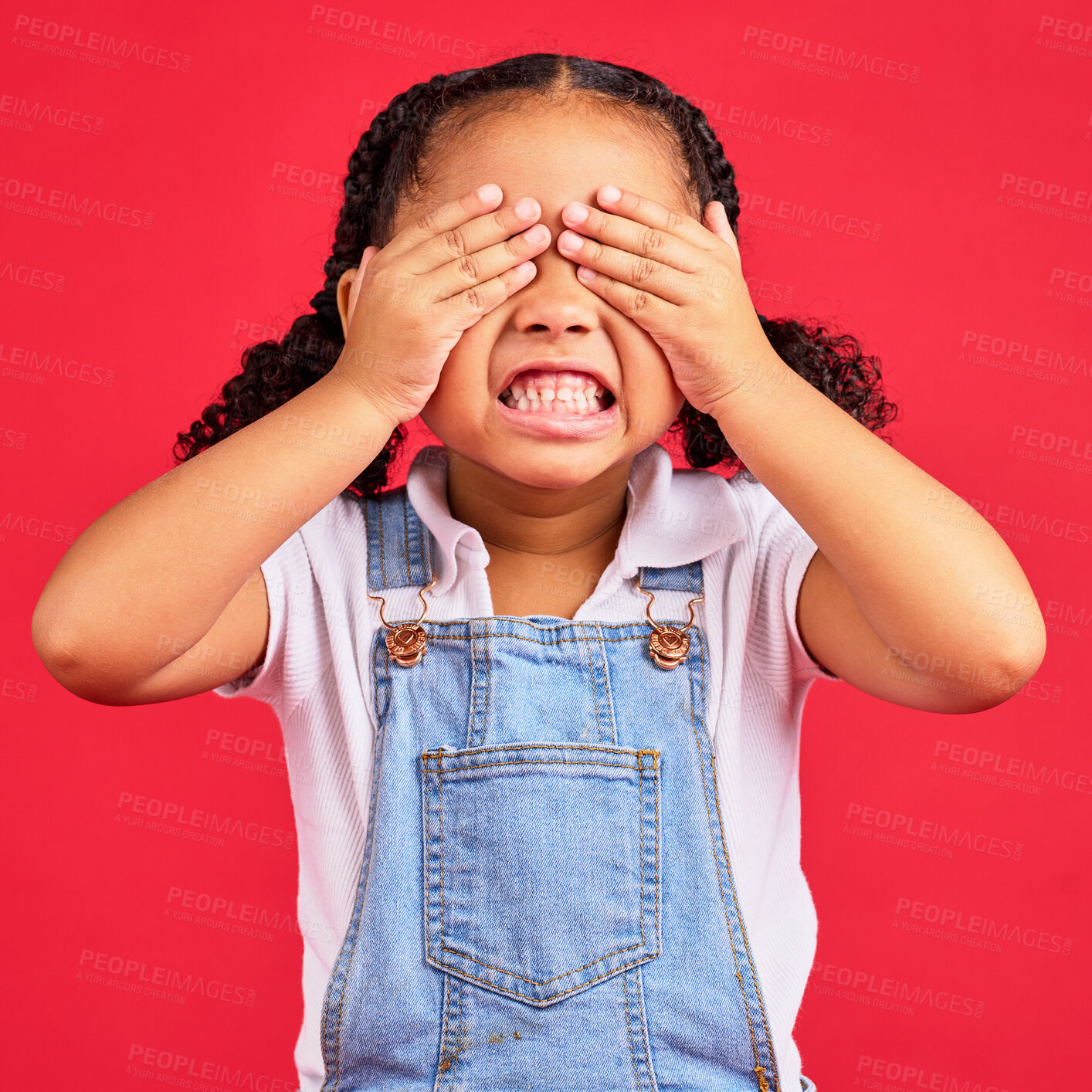 Buy stock photo Child, hands and eyes cover on isolated red background with angry, mad or stubborn facial expression. Girl, kid and youth hiding face in tantrum, autism or adhd for behaviour issue, crisis or problem