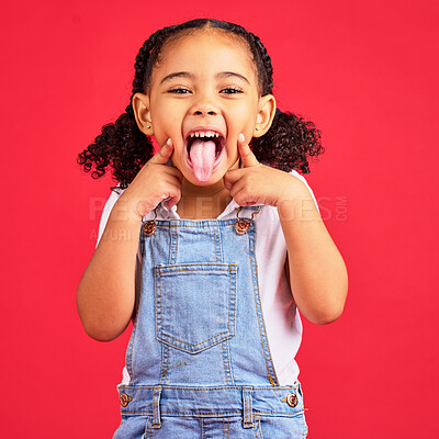 Buy stock photo Little girl, portrait and tongue out on isolated red background in goofy, silly games and playful facial expression. Happy, kid and child with funny face in comic emoji, charades and studio activity