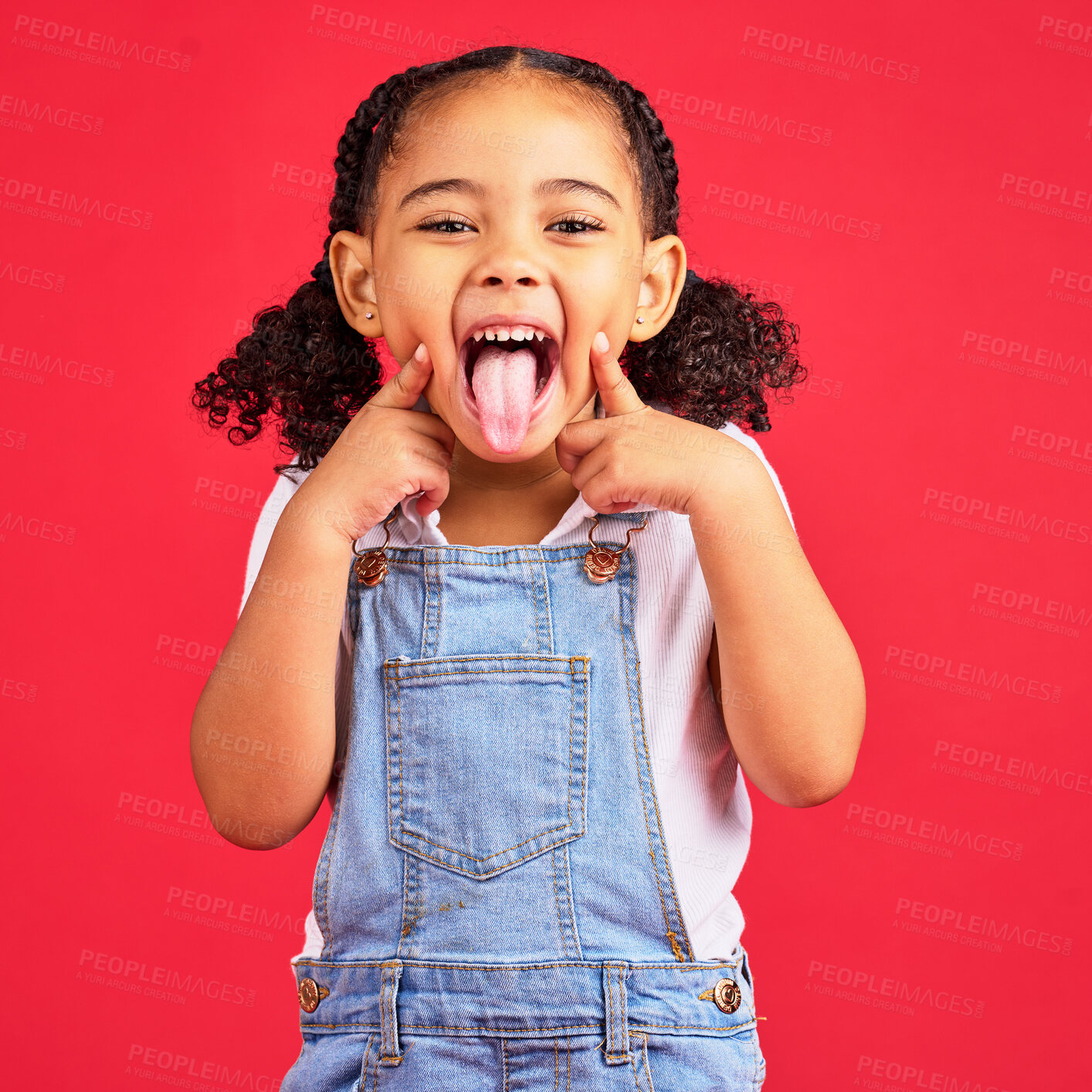 Buy stock photo Little girl, portrait and tongue out on isolated red background in goofy, silly games and playful facial expression. Happy, kid and child with funny face in comic emoji, charades and studio activity