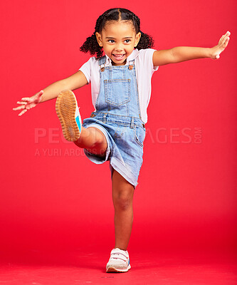 Buy stock photo Happy, youth and girl on red background kick legs for happy childhood, positive mindset and smile. Fashion mockup, summer style and cute face of child in studio with freedom, carefree and happiness
