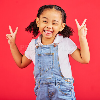 Buy stock photo Happy, peace sign and wink with portrait of girl for summer, happiness and funny face. Meme, fashion and smile with child and hand sign for youth, comedy and positive in red background studio 