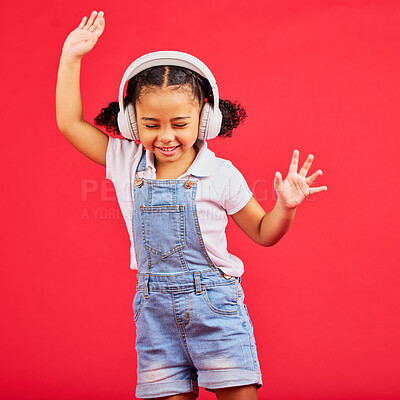 Buy stock photo Dance, energy and happy child on music headphones, fun radio and dancing podcast on isolated red background. Smile, girl and dancer kid listening to audio, streaming sound and media on studio mockup