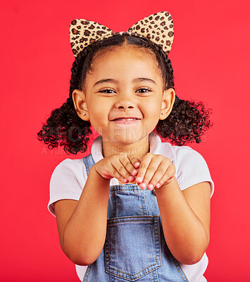 Buy stock photo Girl, portrait and leopard headband in studio for fancy dress, pretend play and imagination in red background. Happy children, animal print fashion and hands excited for fun, happiness and cute pose 