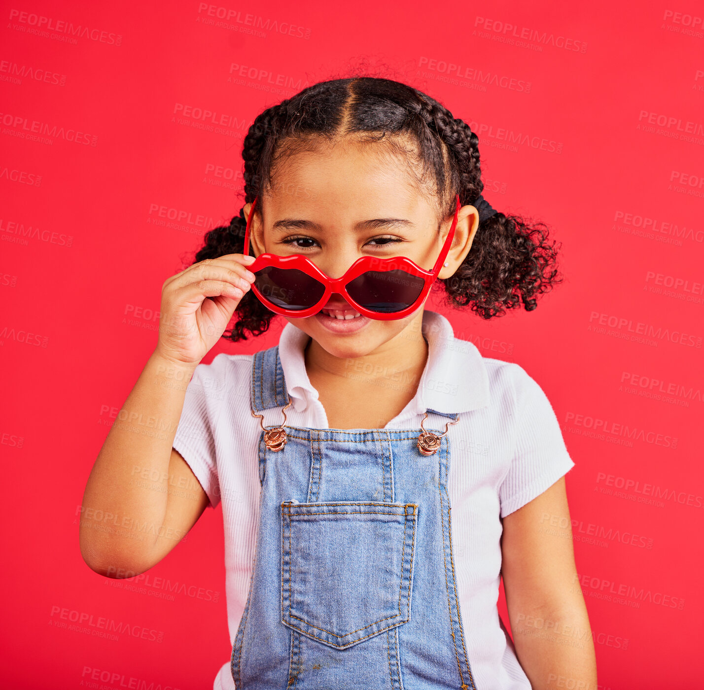 Buy stock photo Child portrait, fashion and glasses on isolated red background in summer trend, holiday style and cool vacation. Smile, happy and kid with sunglasses for eyes healthcare, wellness and sun protection