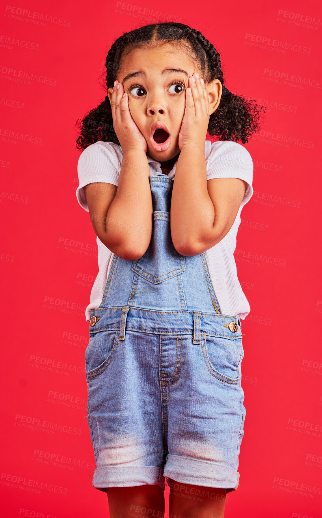Buy stock photo Little girl, shocked or hands on face by isolated red background in kids gossip, bad news or scary children story. Surprised, anxiety or scared youth with horror facial expression, wow or emoji look