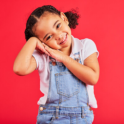 Buy stock photo Happy, smile and cute young girl child portrait with red studio background with happiness. Smiling, youth and kid model with denim and adorable hands feeling girly, joyful and positive with fashion