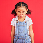 Child, portrait or angry face on isolated red background in autism tantrum, behavior or stubborn studio problem. Mad, annoyed or frustrated little girl and sulking, grumpy or anger facial expression