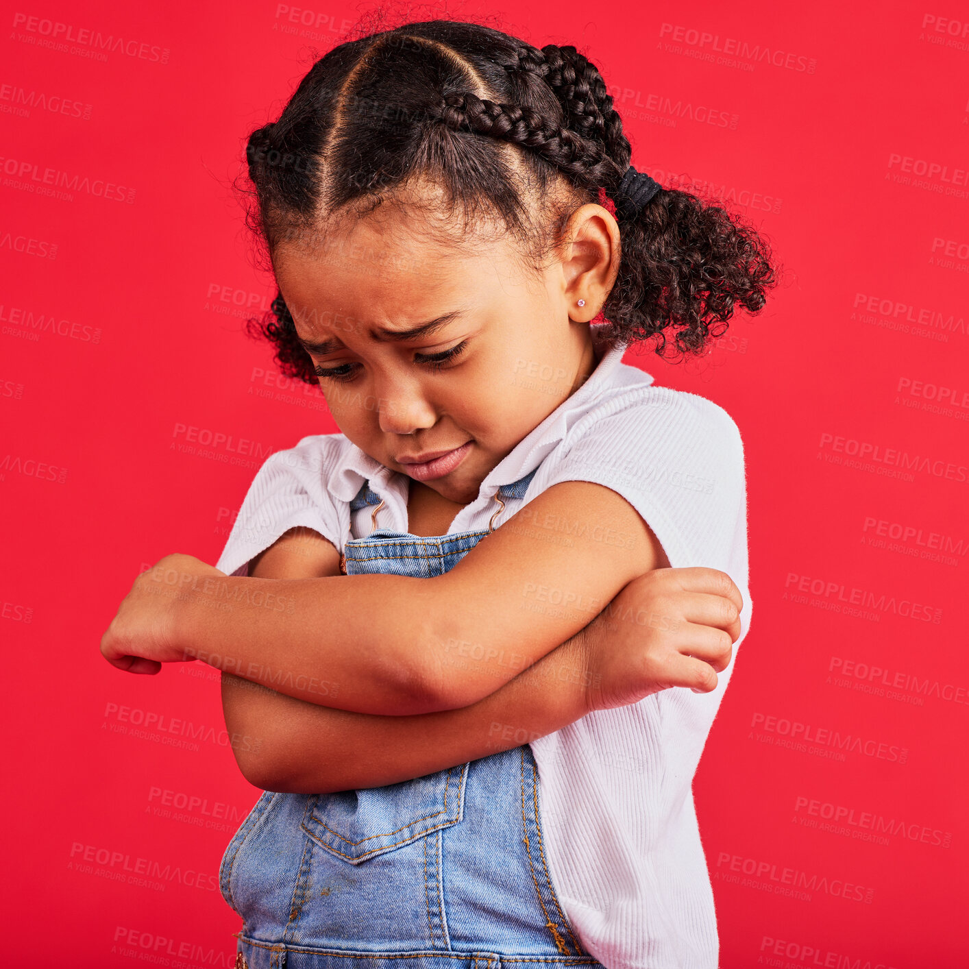 Buy stock photo Kid, arms crossed or crying expression on isolated red background in depression, mental health or burnout. Upset, unhappy or little girl with sad, sulking or grumpy face in bullying crisis or anxiety