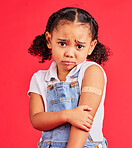 Child portrait, sad and arm plaster in covid vaccine, injection and fall injury on isolated red background. Upset, unhappy and hurt girl and bandage in medical help, healthcare wellness and first aid